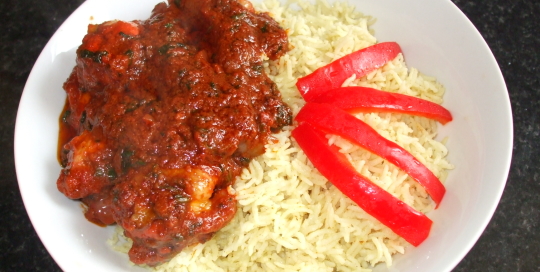 cooked curry rice with tandoori chicken curry